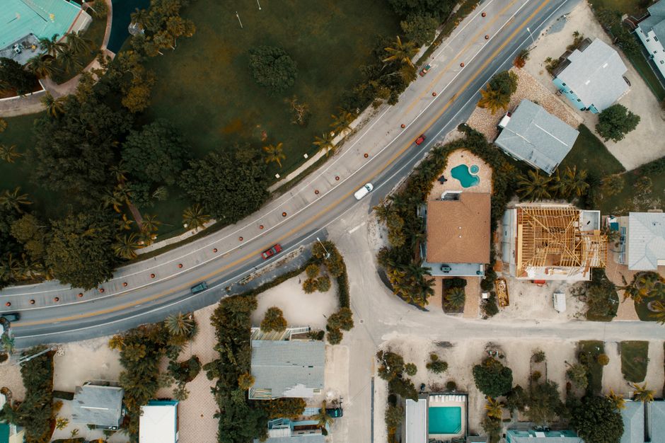 Aerial drone view of residential roofing showing structure and condition assessment perspective